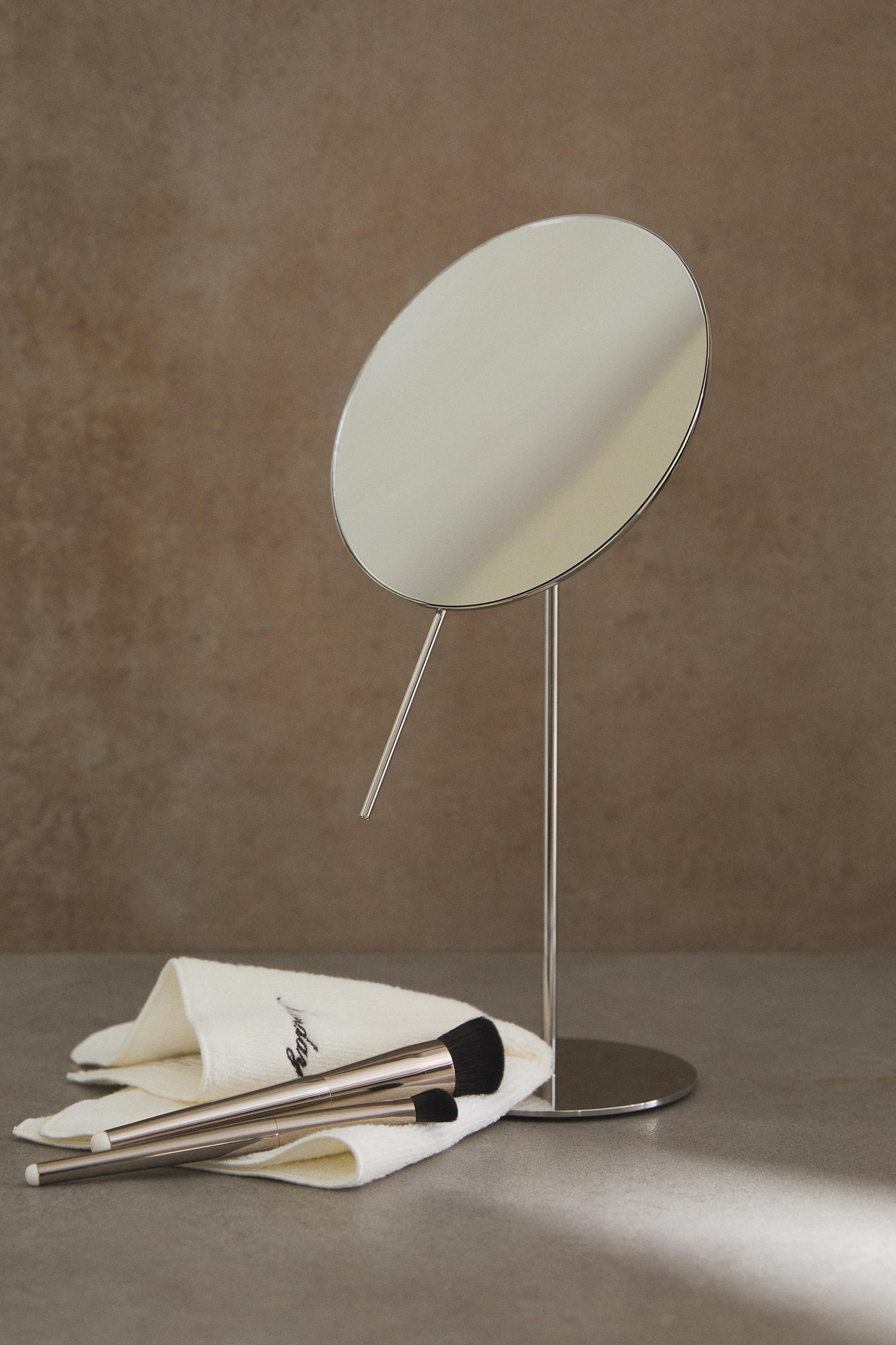 MAGNIFYING METAL MIRROR